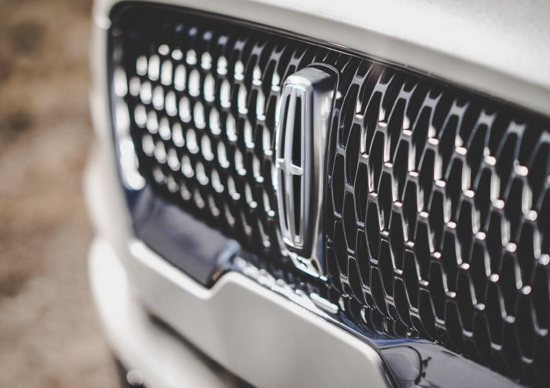 The grille of the 2024 Lincoln Aviator® Reserve model with an eye-catching repeated field of Lincoln Star logo shapes | Empire Lincoln of Huntington in Huntington NY