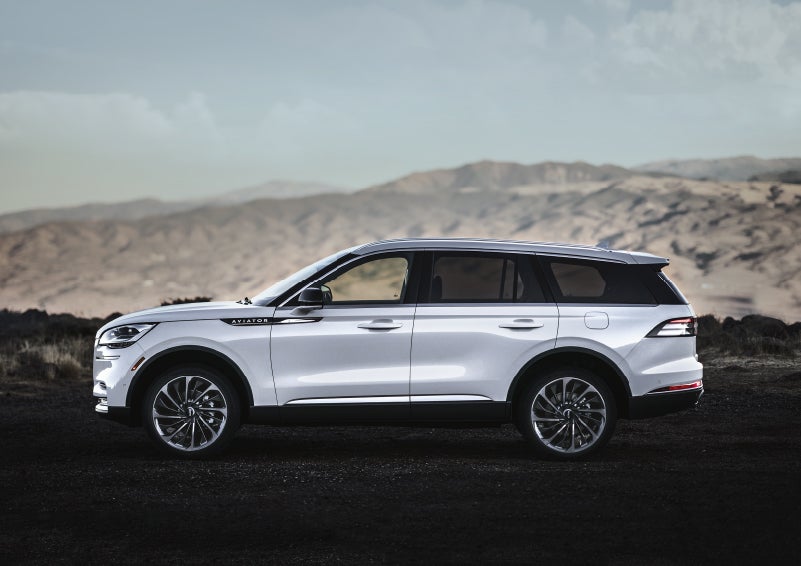 A Lincoln Aviator® SUV is parked on a scenic mountain overlook | Empire Lincoln of Huntington in Huntington NY