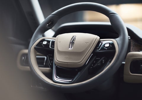The intuitively placed controls of the steering wheel on a 2024 Lincoln Aviator® SUV | Empire Lincoln of Huntington in Huntington NY