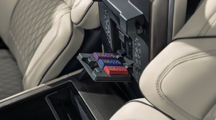 Digital Scent cartridges are shown in the diffuser located in the center arm rest. | Empire Lincoln of Huntington in Huntington NY