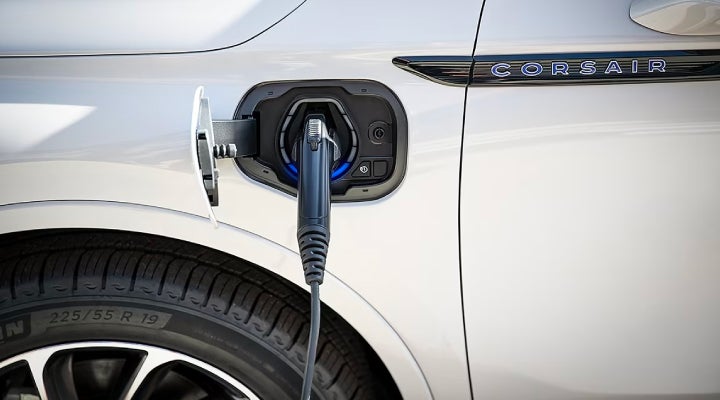 An electric charger is shown plugged into the charging port of a Lincoln Corsair® Grand Touring
model. | Empire Lincoln of Huntington in Huntington NY