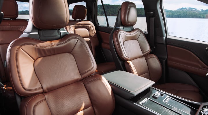 The front row's Perfect Position Seats in a 2024 Lincoln Aviator® Reserve model with Ebony Roast interior | Empire Lincoln of Huntington in Huntington NY