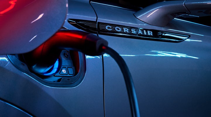 A charger plugged into the charging port of a 2024 Lincoln Corsair® Plug-in Hybrid model. | Empire Lincoln of Huntington in Huntington NY